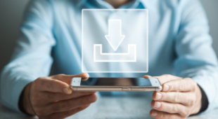 Man holding an ipad with the word 'download' hovering in the air