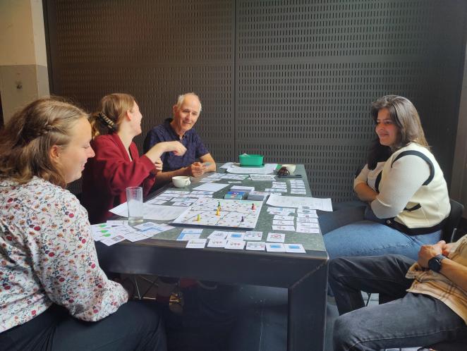 SMALL partners playing accessibility board game 