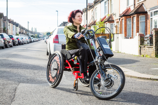 Women on road with mobility bike