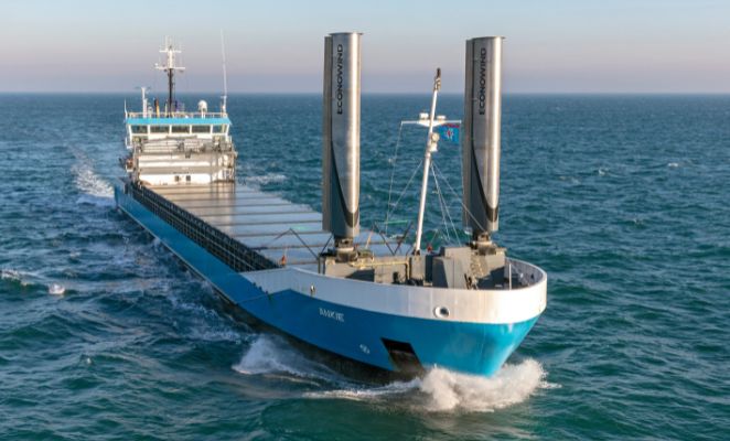 A cargo ship retrofitted with two rotor sails.