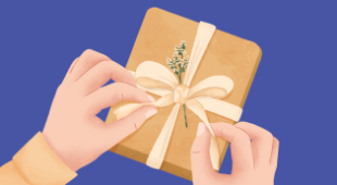 close-up of two hands wrapping a gift