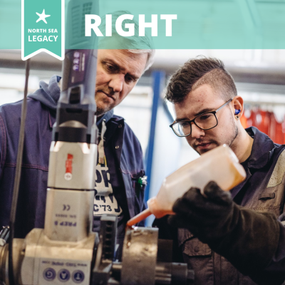 Two workers focused on a manufacturing task.