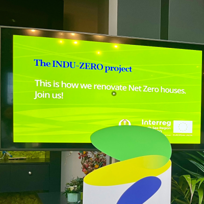 A light green screen providing textual information about the project INDU-ZERO