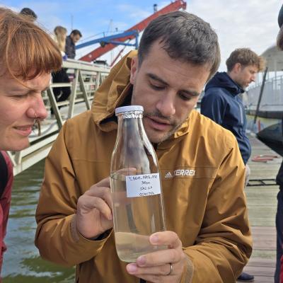 Partners examining Ferry Box sample