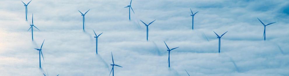 Offshore wind turbines above a mass of clouds in the North Sea