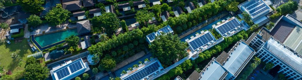 Birds eye view of houses with solar panels