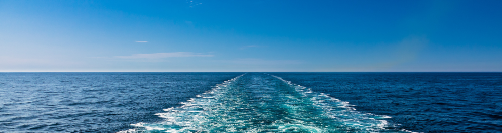 White foam in  ocean in the wake of a ship.