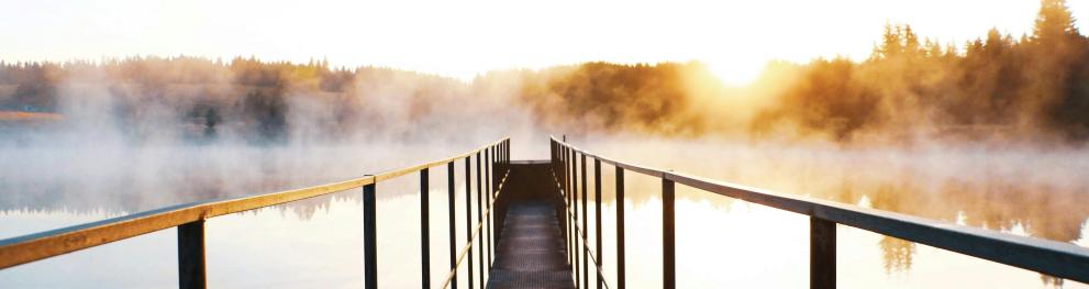 bridge over water with mist