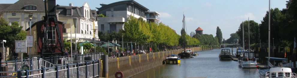 A river with boats and houses